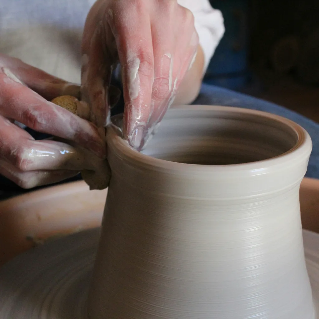 Local Spanish artisan shaping traditional pottery