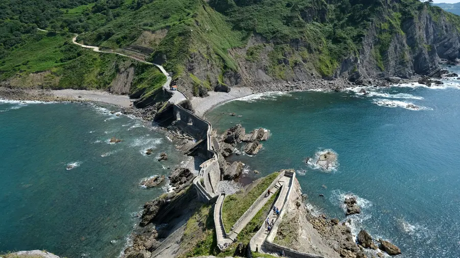 Aerial view of the 241 stone steps and zigzag bridge leading to San Juan de Gaztelugatxe hermitage