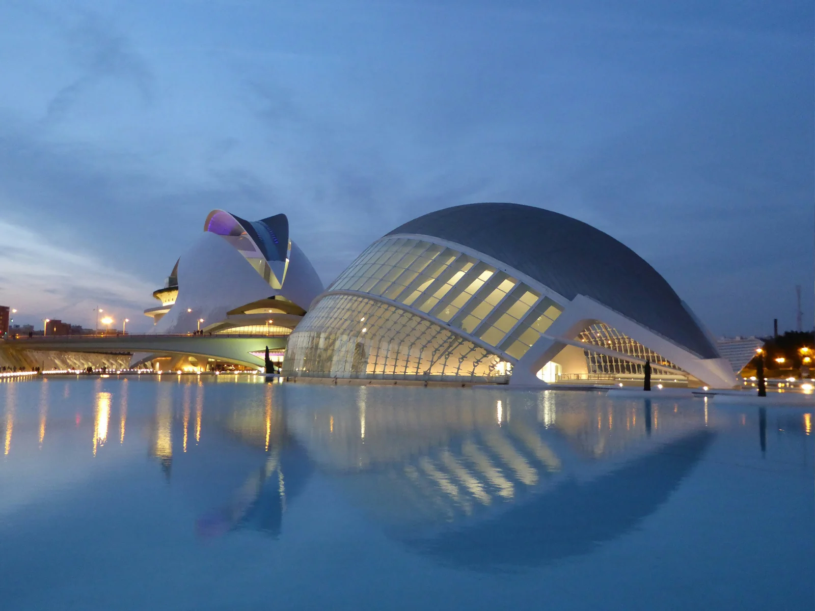 The Hemisfèric and Palau de les Arts Reina Sofía in Valencia reflected in the water pool at twilight