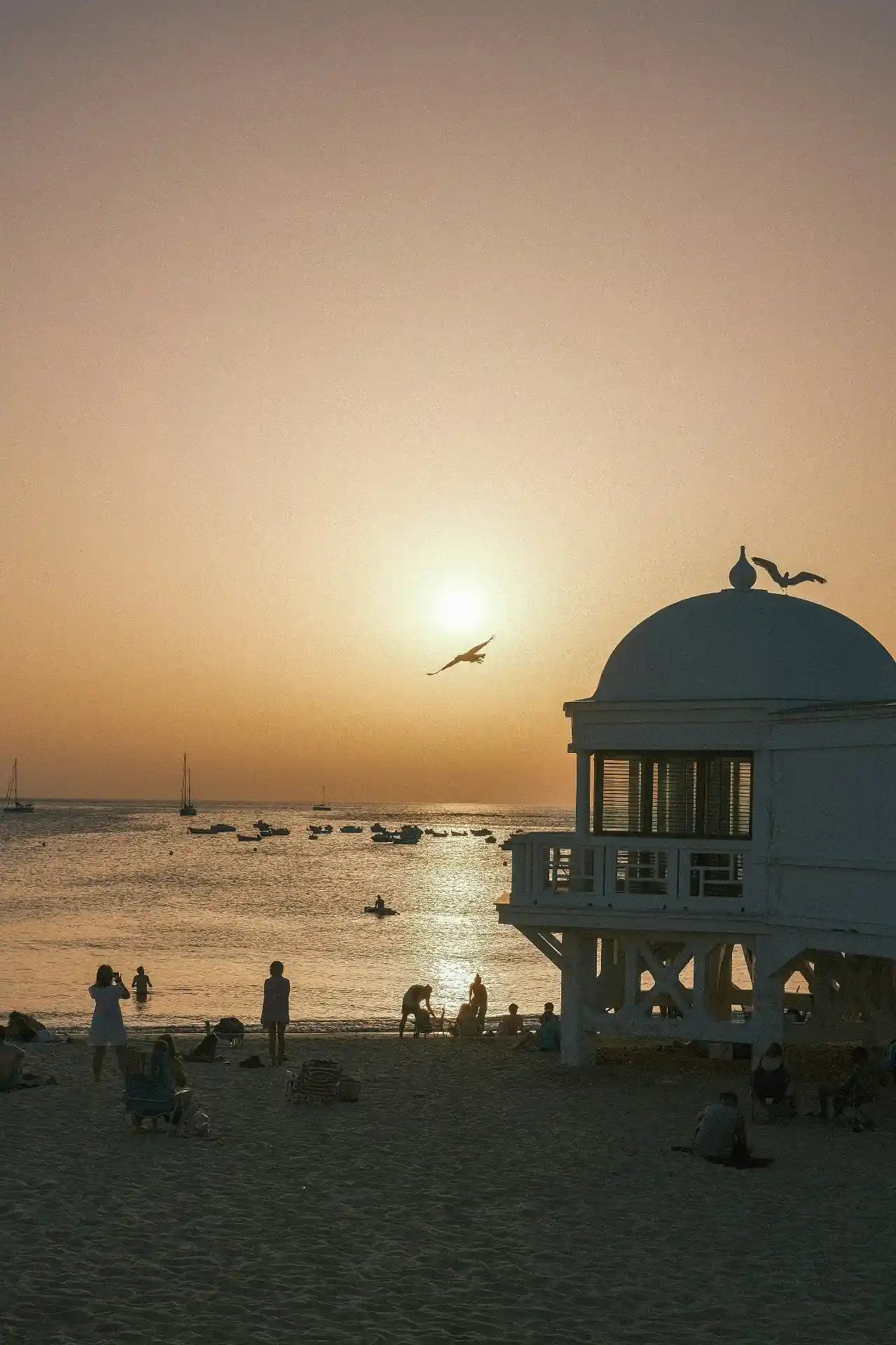La Caleta Beach in Cadiz with the Castle of Santa Catalina seen across calm Atlantic water