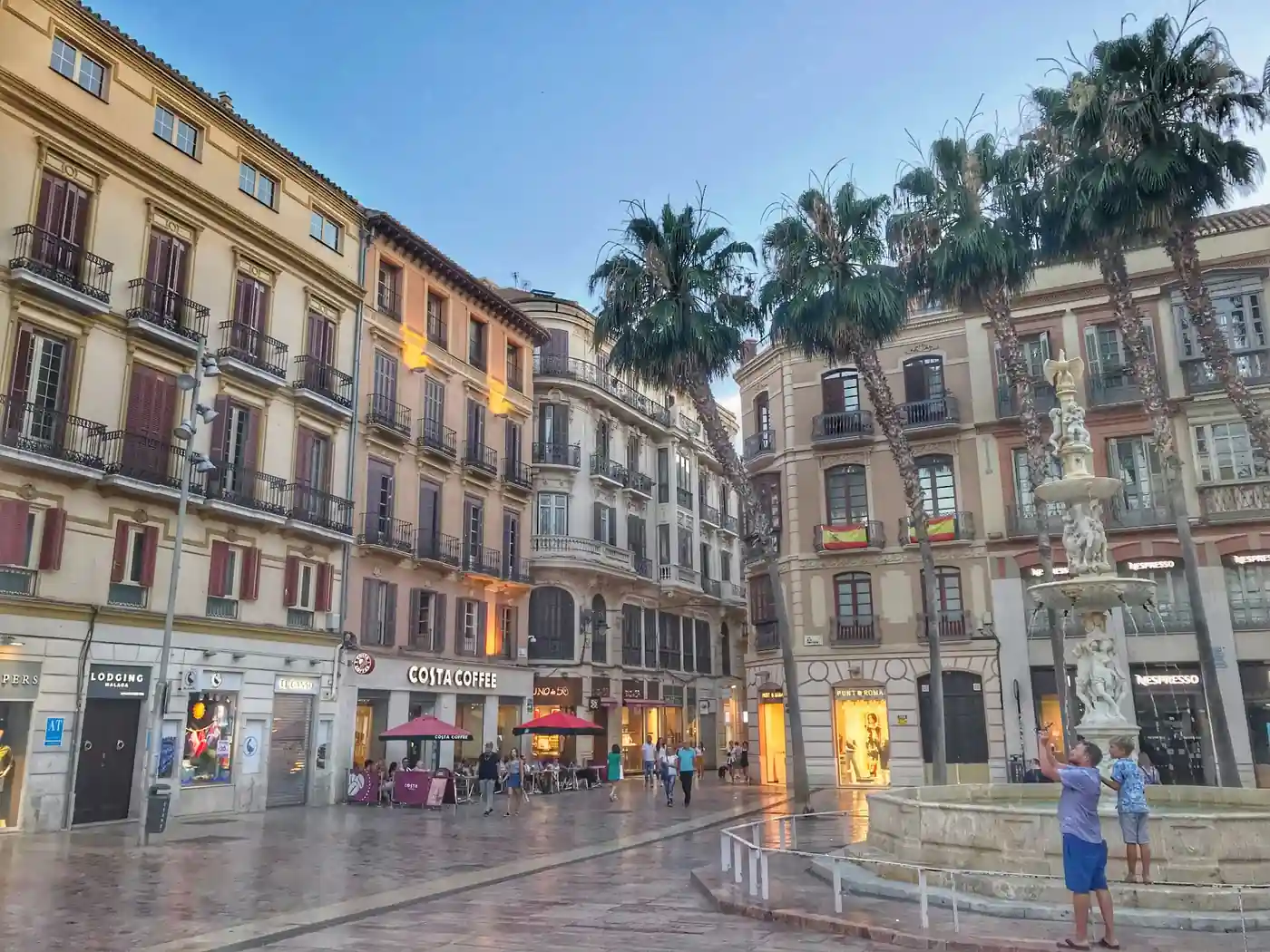 Marques de Larios Street in Malaga with marble pavement and elegant historic architecture
