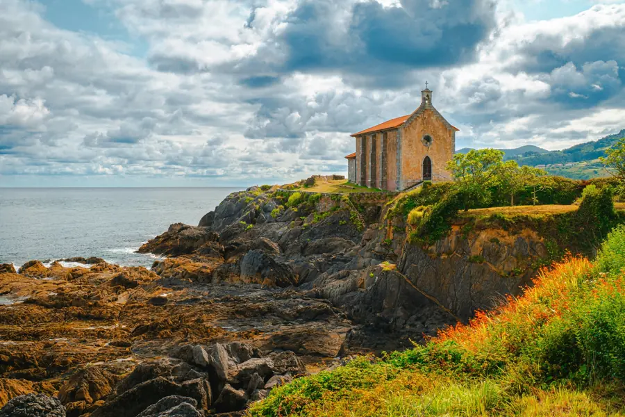 Santa Katalina hermitage perched on the rocky coast near Mundaka village in the Basque Country