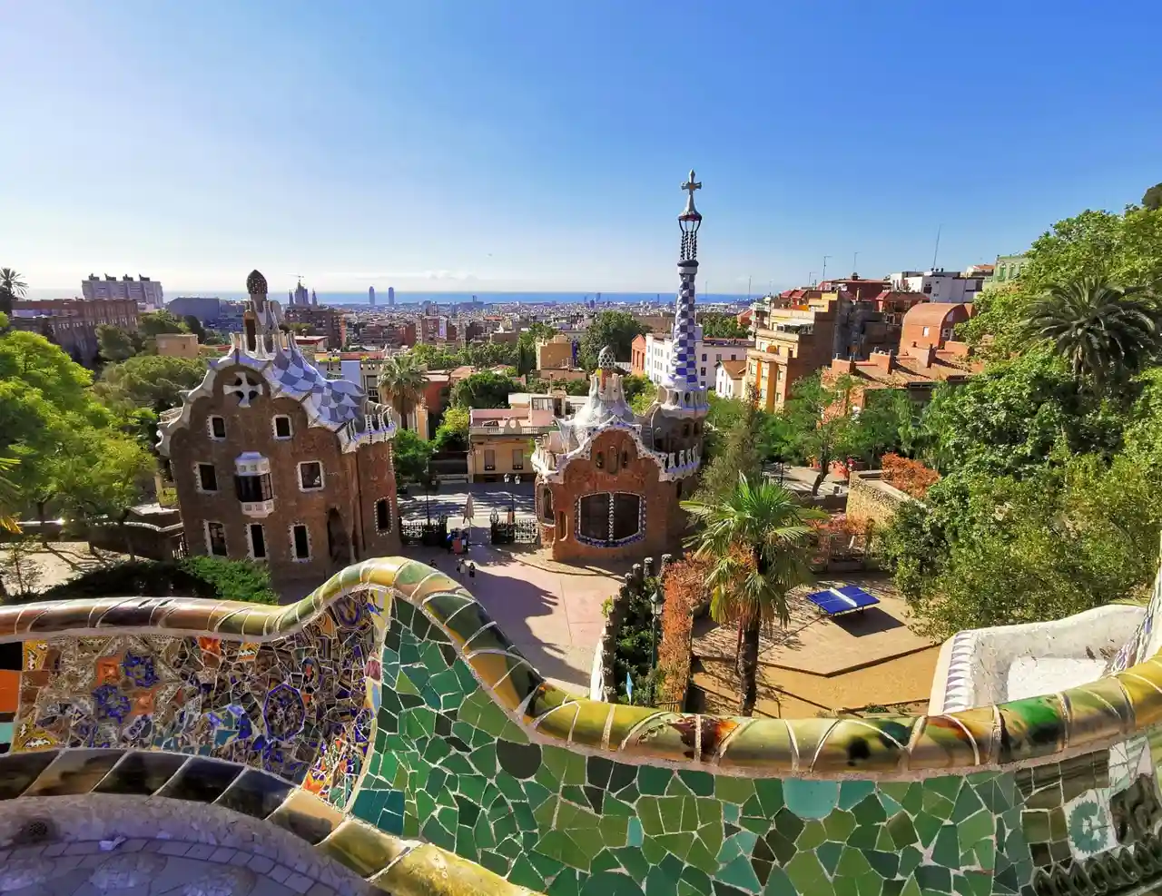 Gaudí mosaic at Park Güell with Barcelona views