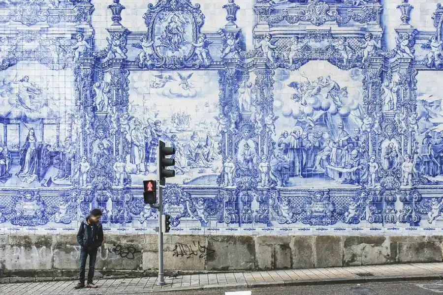 Hand-painted blue and white azulejo tile murals on a historic façade in Porto's old town