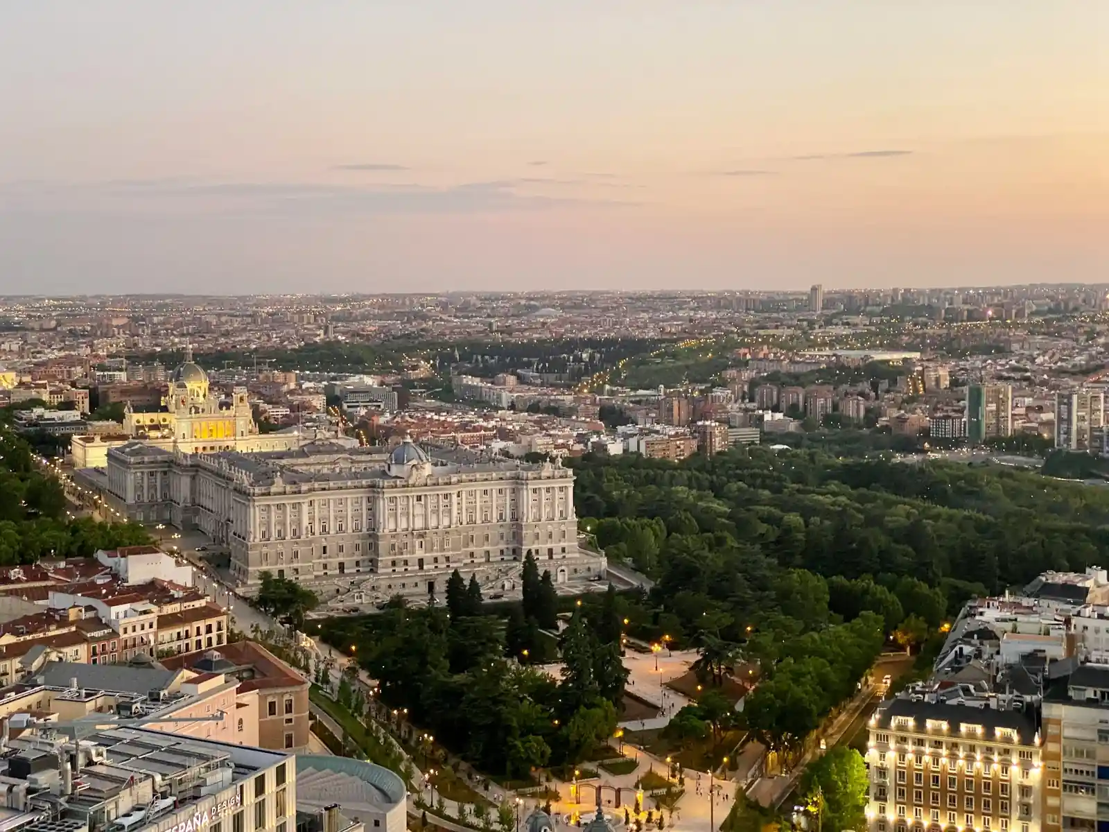 Aerial view of the Royal Palace of Madrid and Almudena Cathedral at sunset