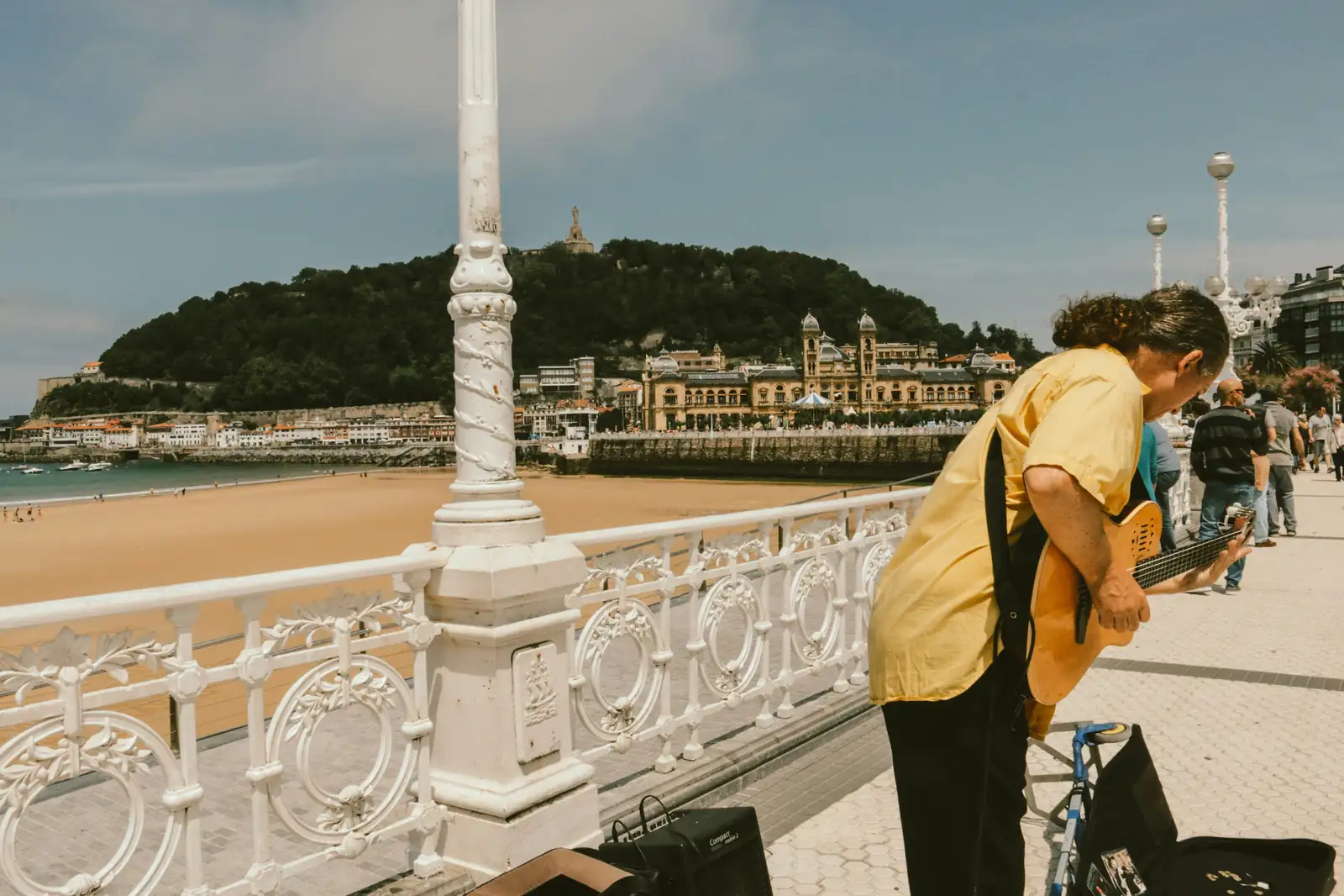 La Concha promenade in San Sebastián with the historic white railing, Monte Urgull and the bay in the background