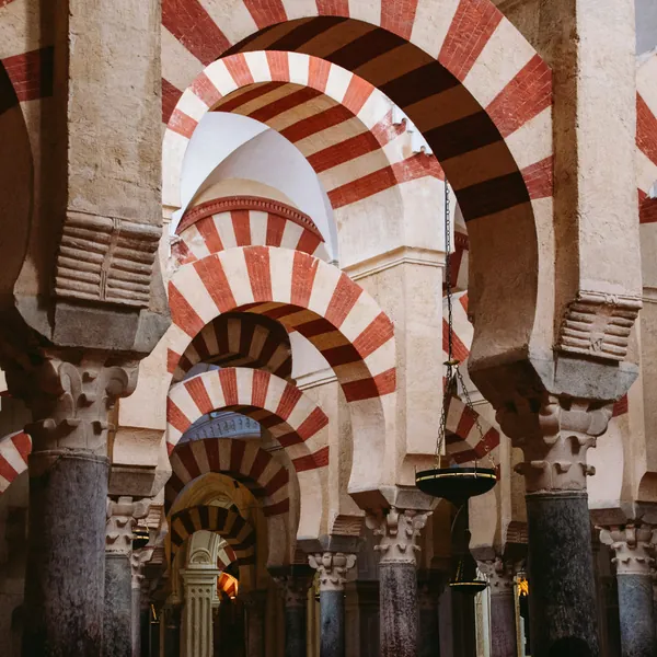 The striped arches inside the Mosque-Cathedral of Córdoba